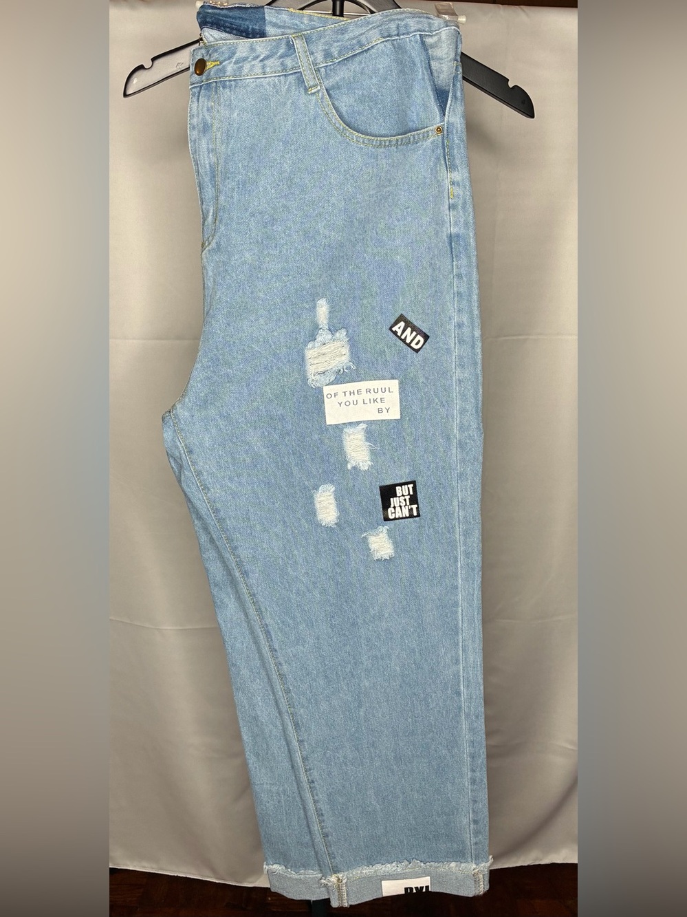 Light Blue Distressed Jeans with Graphic Patches